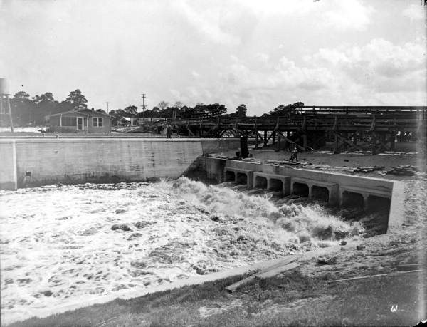 A typical Florida residential drainage canal cutting through a platted subdivision.